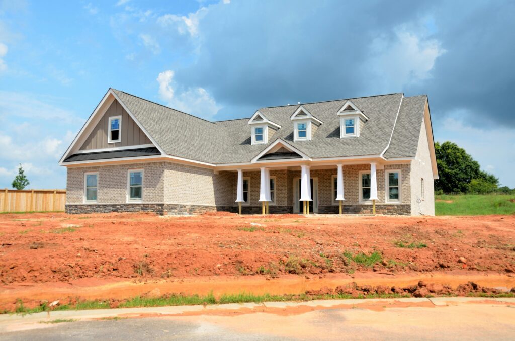 pexels-photo-534228-534228 Brick modern family home under bright sky, showcasing new construction and architectural style.