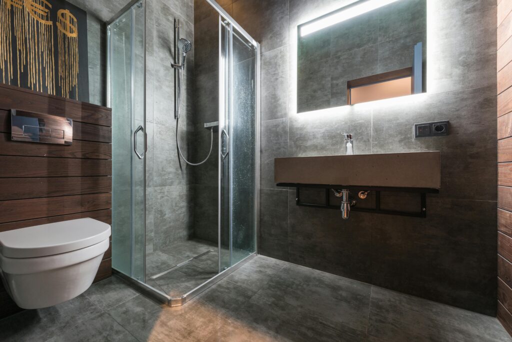 pexels-photo-7587866-7587866 Sleek modern bathroom featuring a glass shower and elegant fixtures.