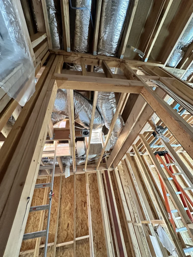 Roof framing and insulation detail during Southern California custom home construction
