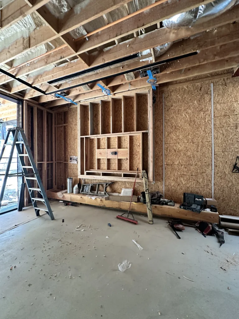 Wide view of interior wall and ceiling framing on a Southern California custom home project