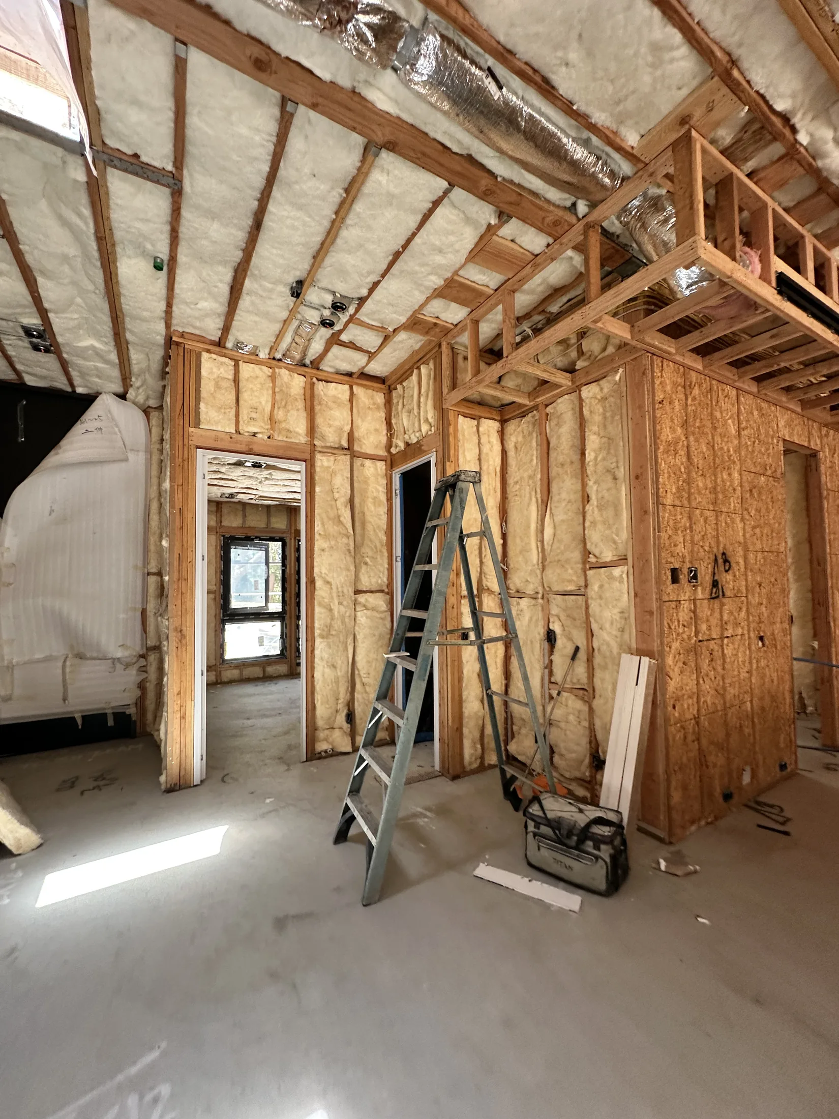 HVAC ductwork and insulation in an unfinished custom home