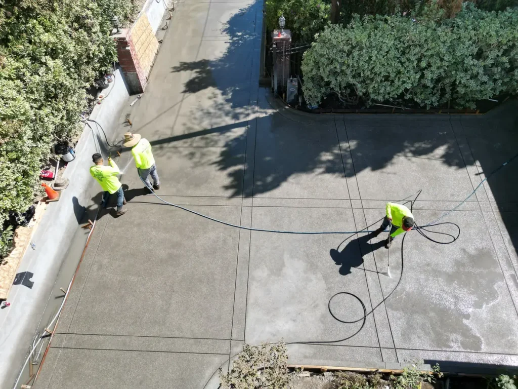 Overhead view of crew working on the driveway surface.