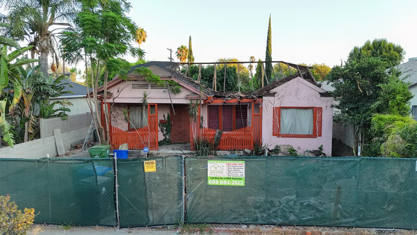 Custom Home Builders Los Angeles 15 Front exterior during roof demolition for a whole-home renovation.