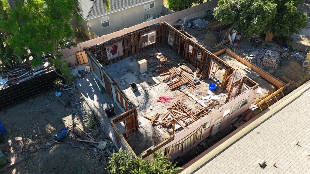Opposing aerial view showing the interior footprint and remaining walls.