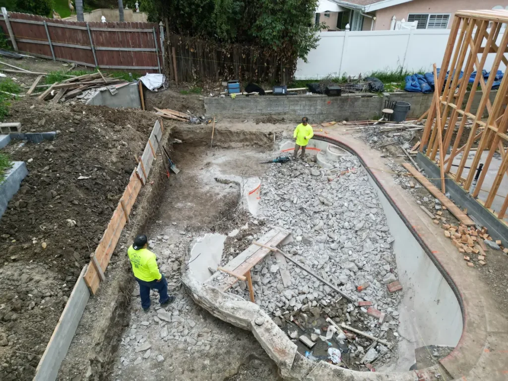 Earlier pool removal and site preparation beside the custom home.