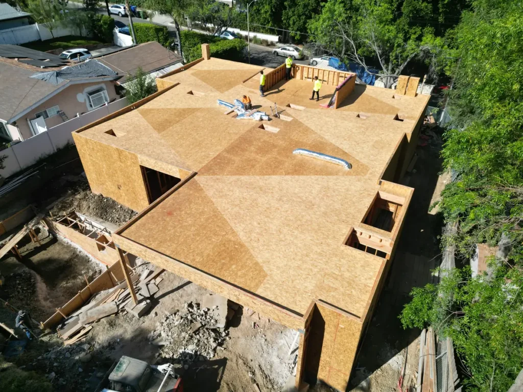 Roof decking in place over the framed custom home.