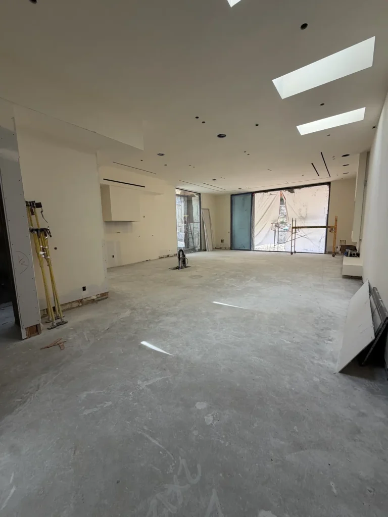 Great room with drywall surfaces and a large ceiling opening.