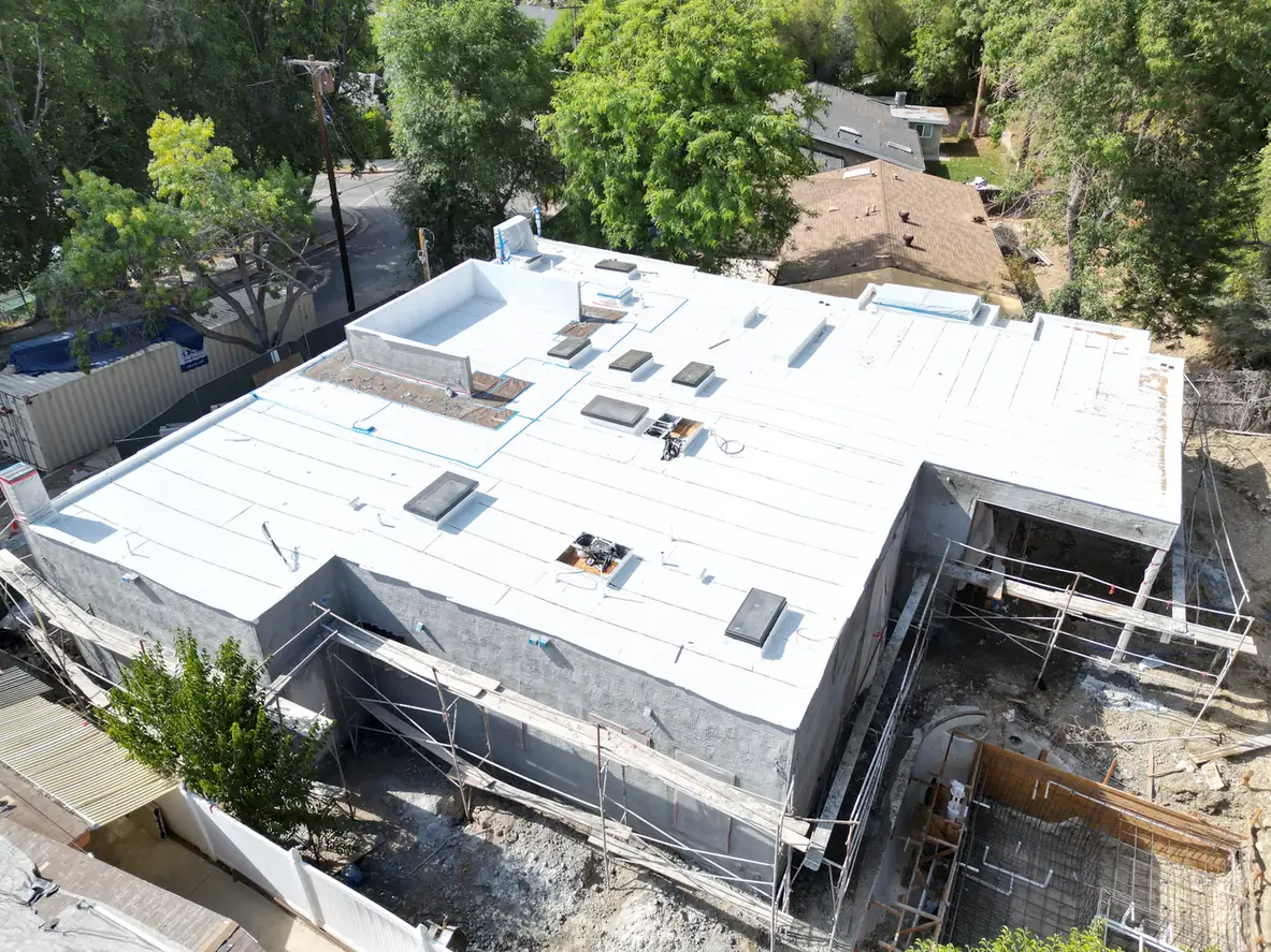 Custom Home Builders Los Angeles 14 Exterior and roof areas of the custom home under construction.