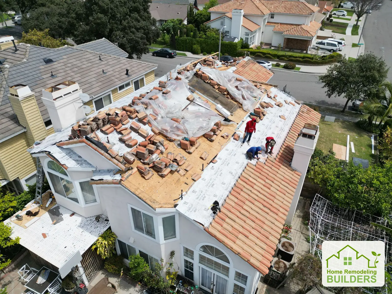 The crew preparing the main roof section for the next tile courses. Cerritos roofing project.