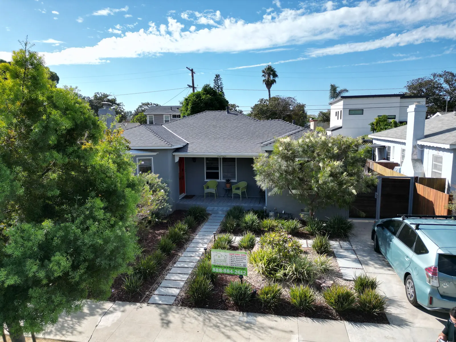 The finished shingle roof and landscaped approach from above in Culver City.