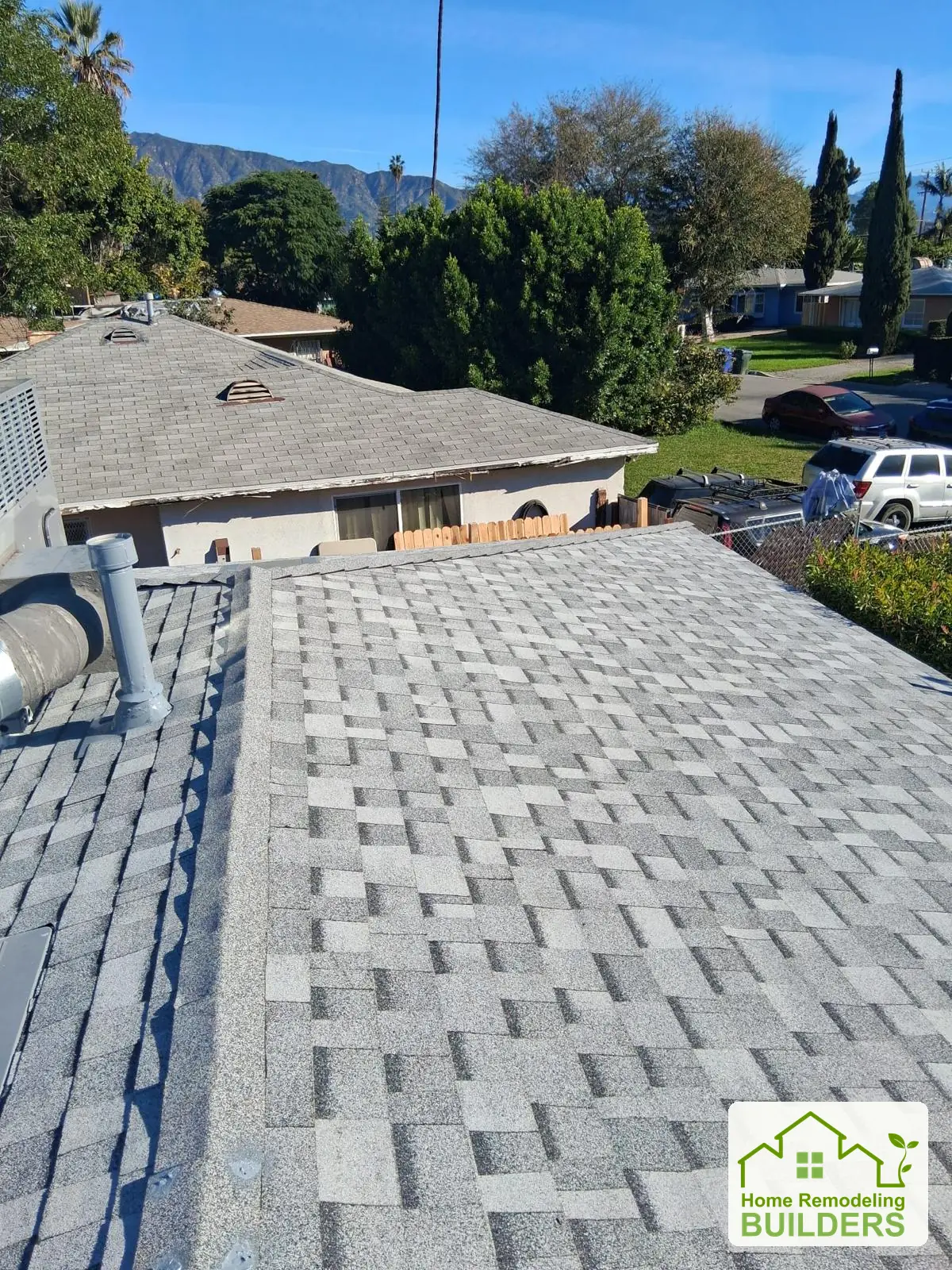 Finished shingles along the roof edge. Duarte roofing project.