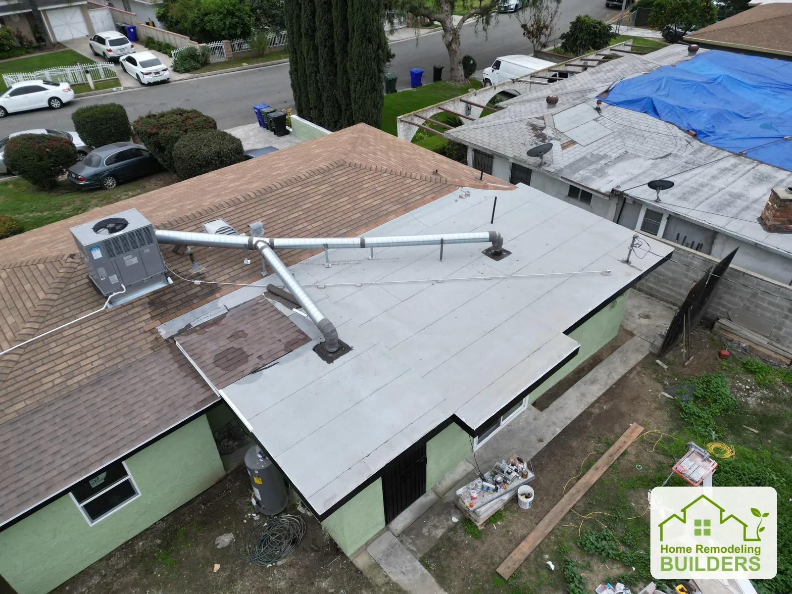 The original flat-roof area and rooftop ductwork. Duarte roofing project.