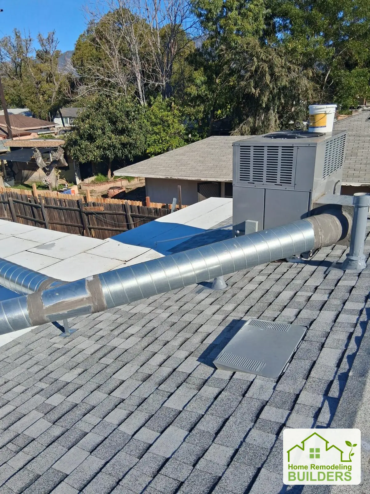 Finished shingle roofing around the rooftop equipment. Duarte roofing project.