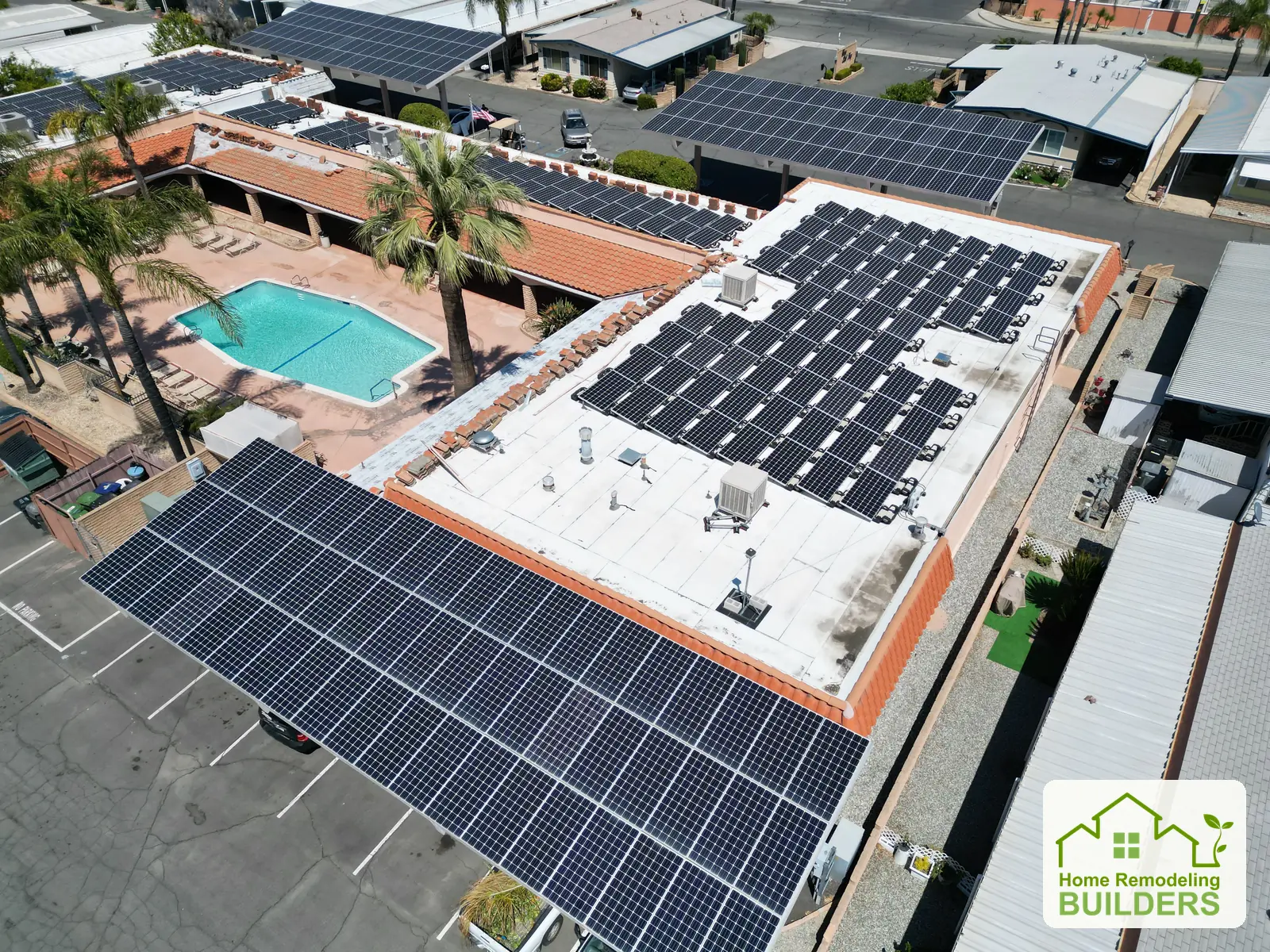 Roof work around the existing solar arrays, with tiles staged along the perimeter. Hemet roofing project.