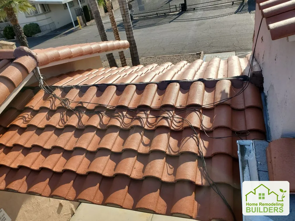 A closer look at the original tile condition and roof junction. Hemet roofing project.