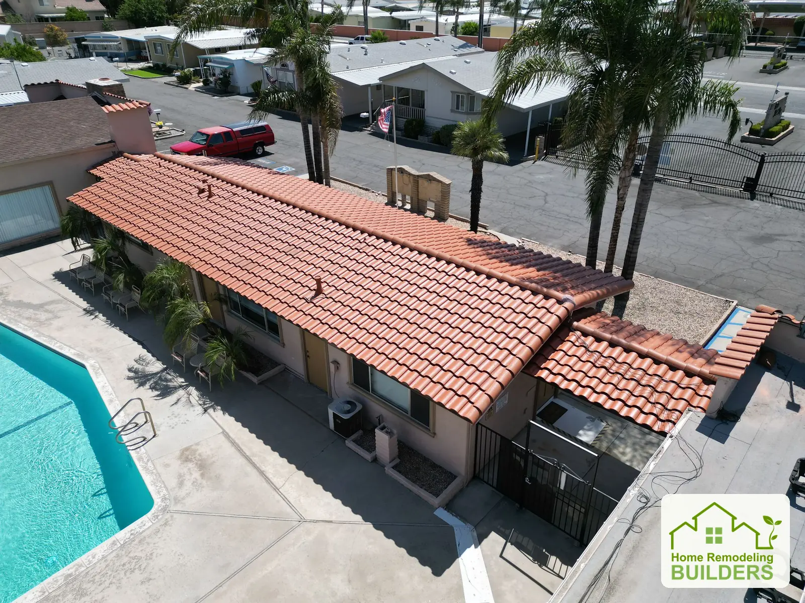 An aerial view of the tiled tile roof beside the pool. Hemet roofing project.