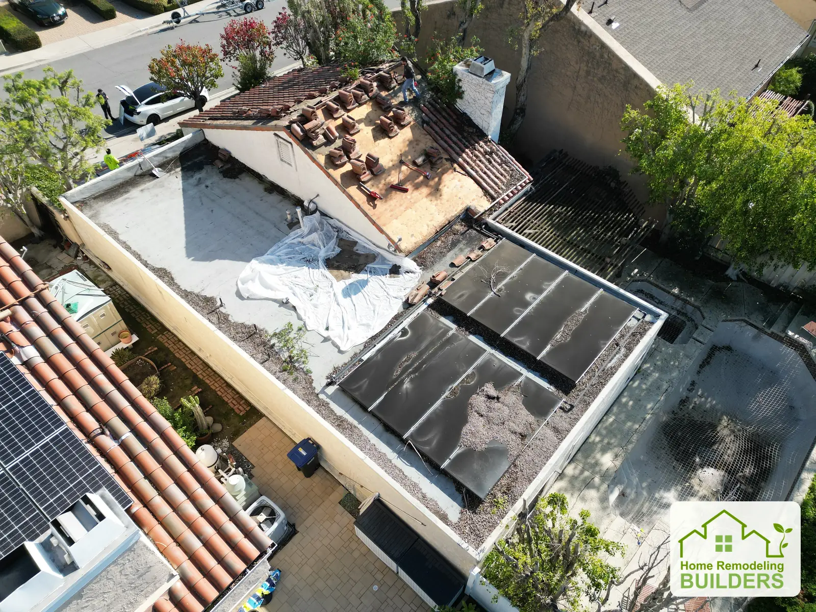 The jobsite and roof preparation viewed from an elevated angle. Laguna Hills roofing project.