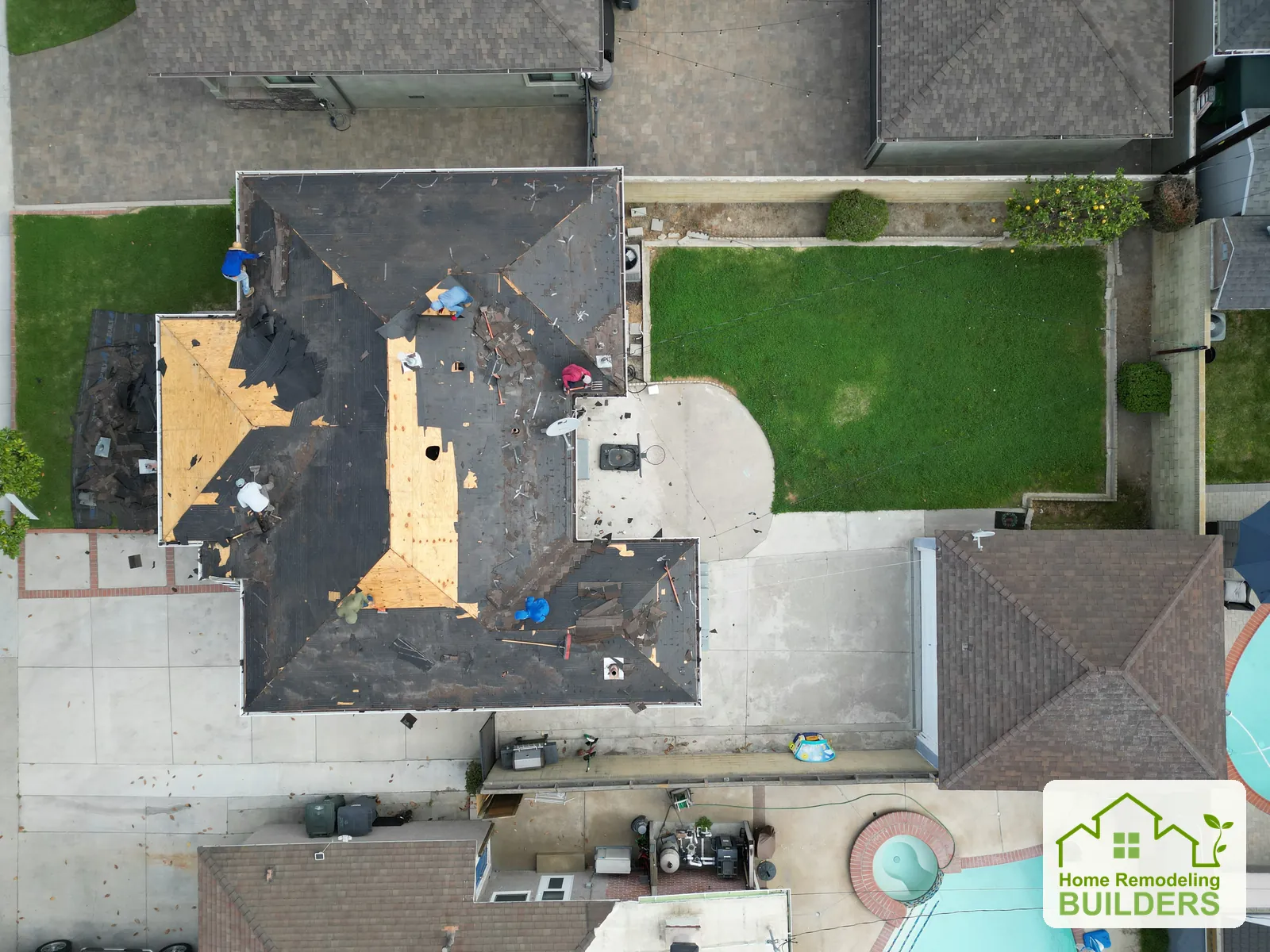 An overhead view of the exposed roof deck and removal work. Lakewood roofing project.
