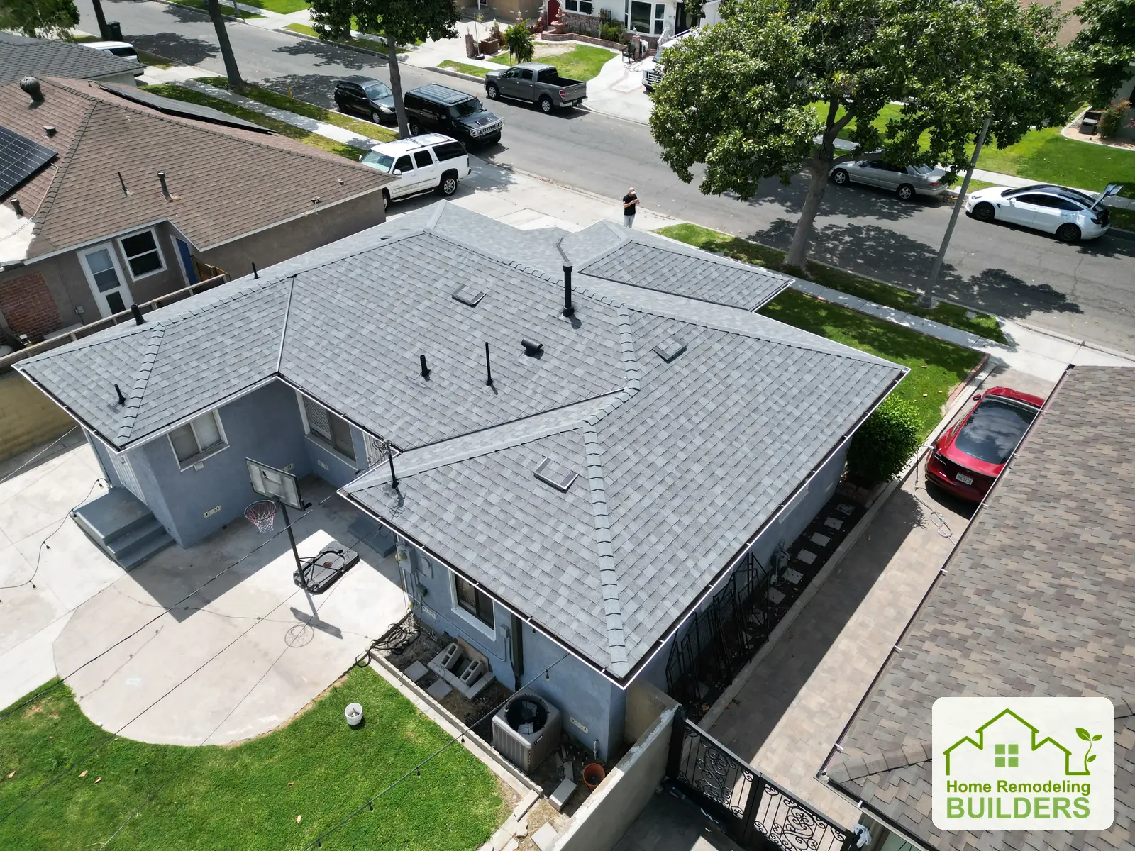Finished shingles, ridges, and roof penetrations from above. Lakewood roofing project.