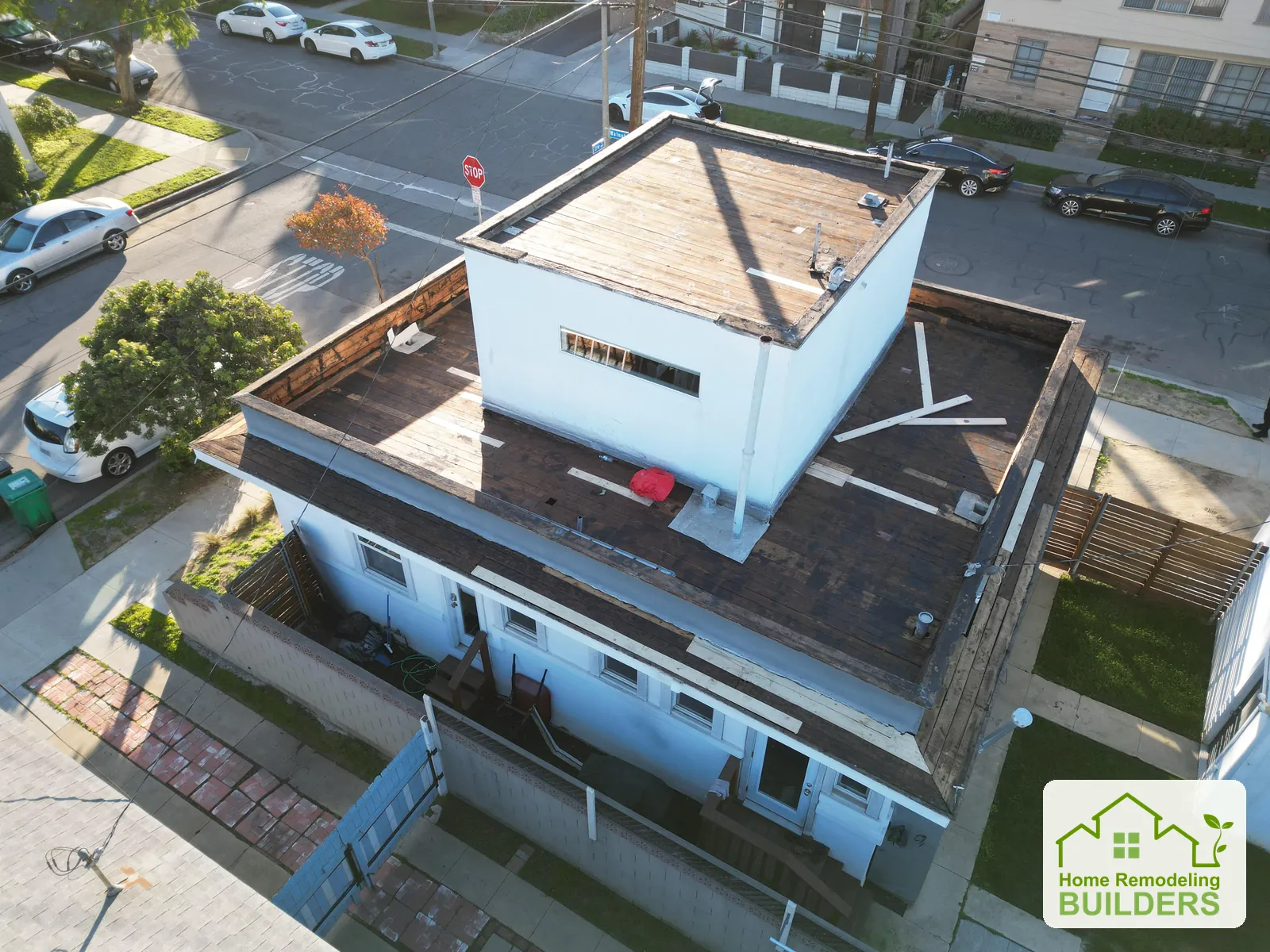 An aerial view of the exposed upper and lower roof decks. Long Beach roofing project.