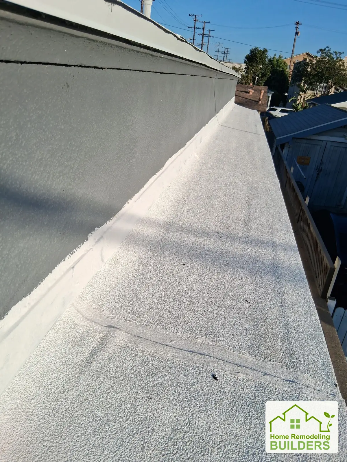 The completed narrow roof section and wall flashing. Long Beach roofing project.