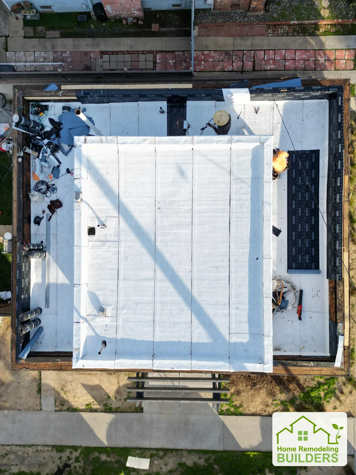 An overhead view as the new roofing surface is installed. Long Beach roofing project.