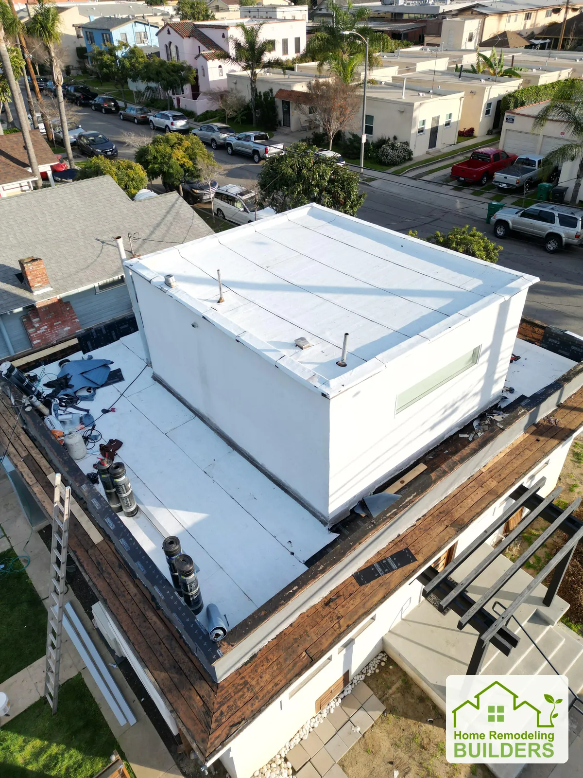 Installation progressing around the upper structure. Long Beach roofing project.