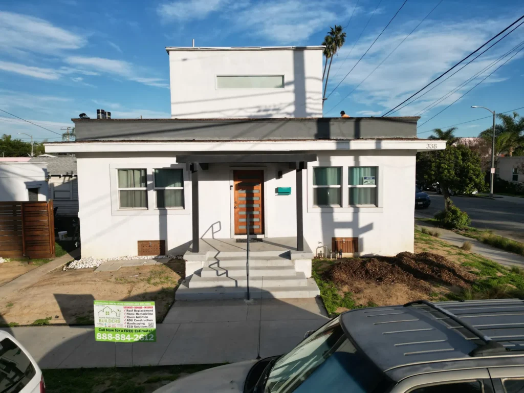 Roof Replacement Contractor Los Angeles 14 The Long Beach home with the company jobsite sign. Long Beach roofing project.