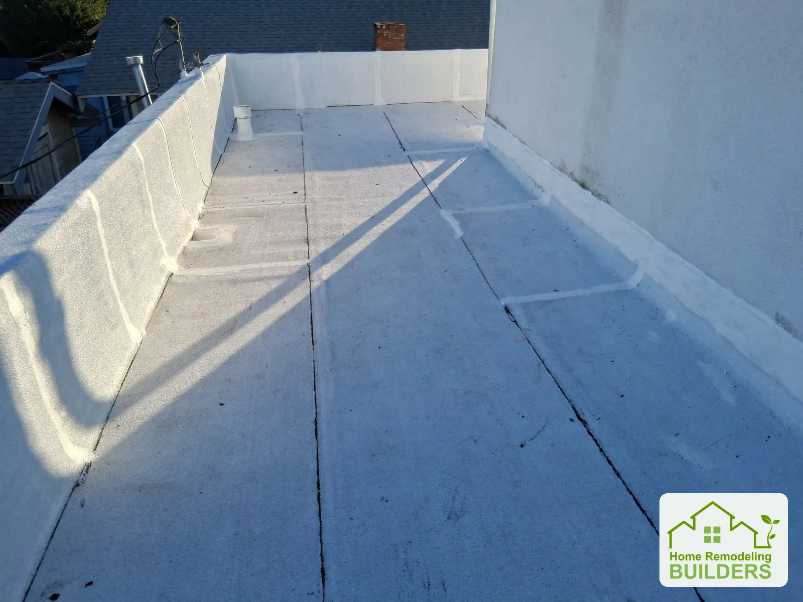 Finished seams and wall transitions on the upper roof. Long Beach roofing project.