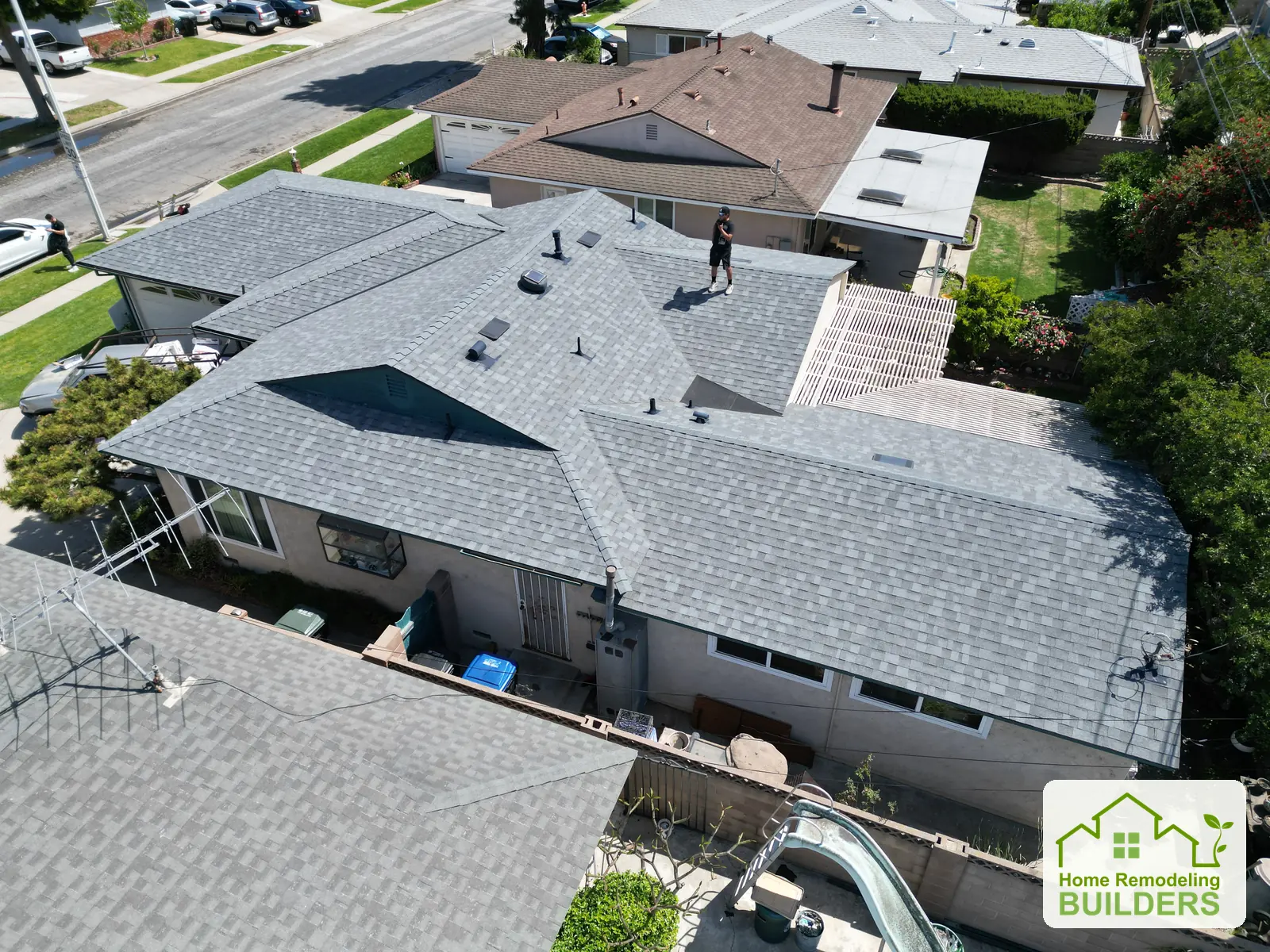 The completed roof slopes and roof penetrations from above. Norwalk roofing project.