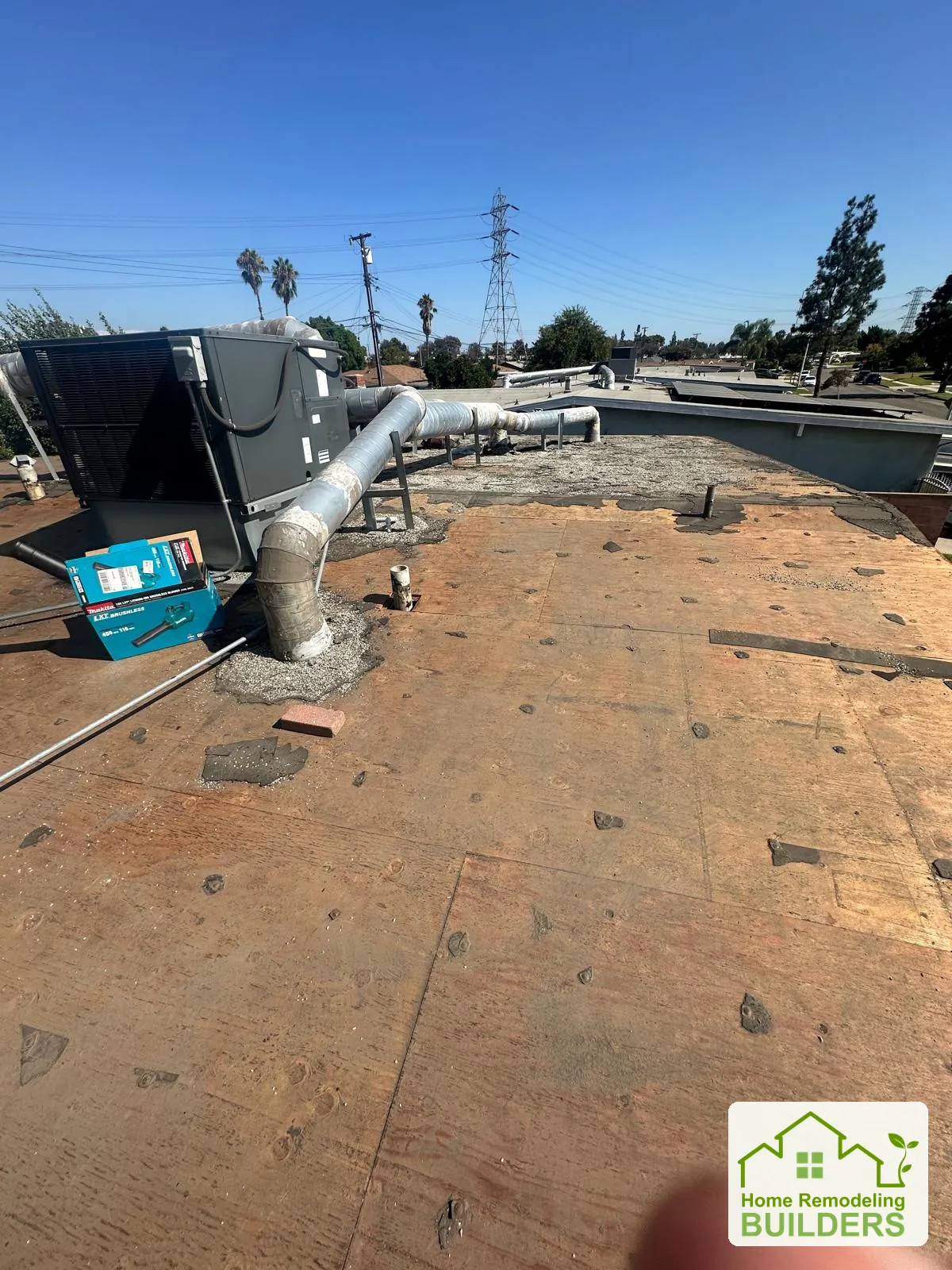 The exposed roof deck around the equipment. Pico Rivera roofing project.
