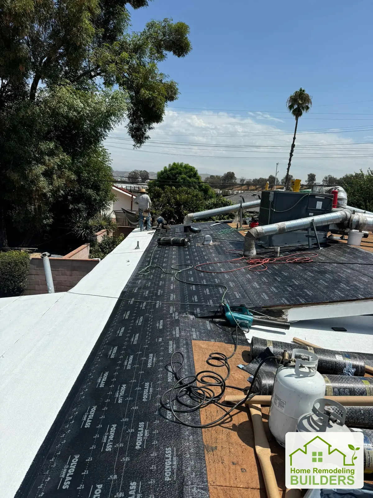 Underlayment and the new roofing surface along the perimeter. Pico Rivera roofing project.