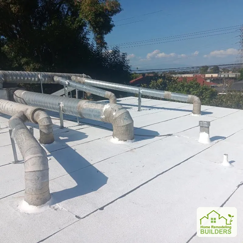 The finished roof around the rooftop duct supports. Pico Rivera roofing project.