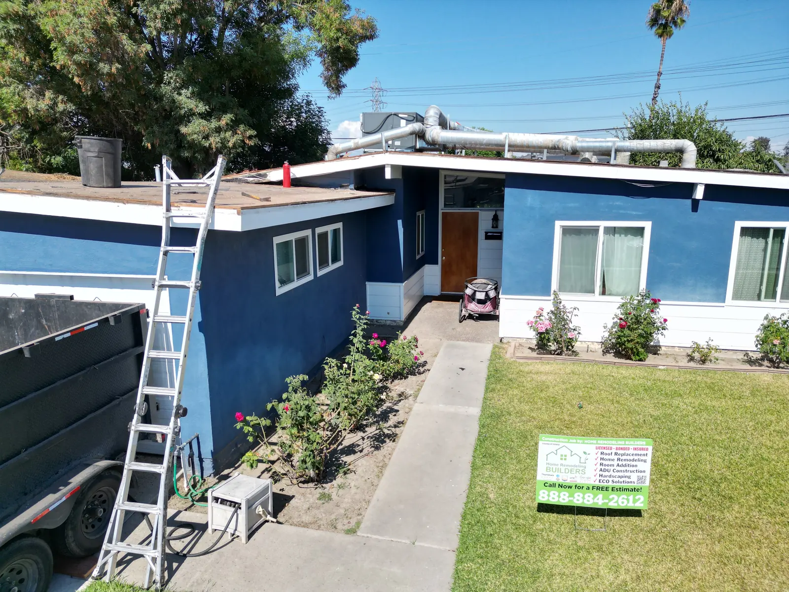 The Pico Rivera jobsite with the company sign and roof access. Pico Rivera roofing project.