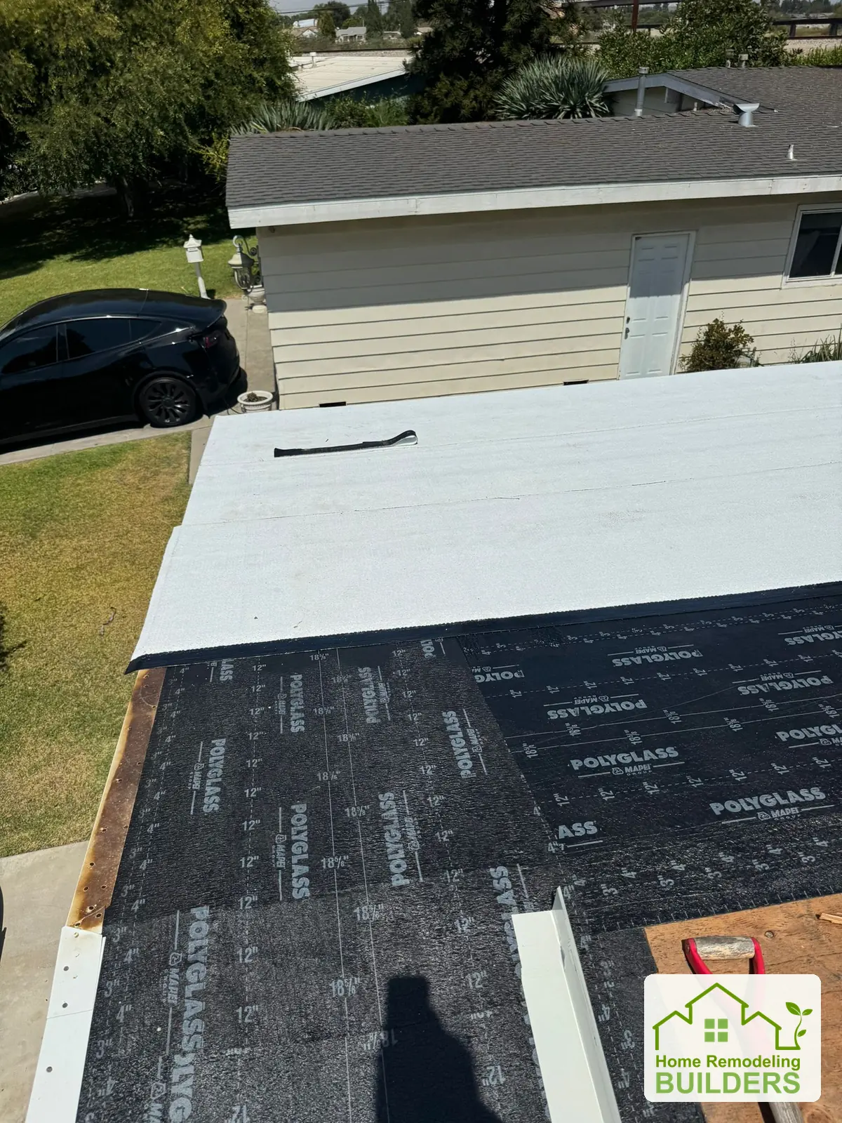 A close view of the transition between roofing layers. Pico Rivera roofing project.