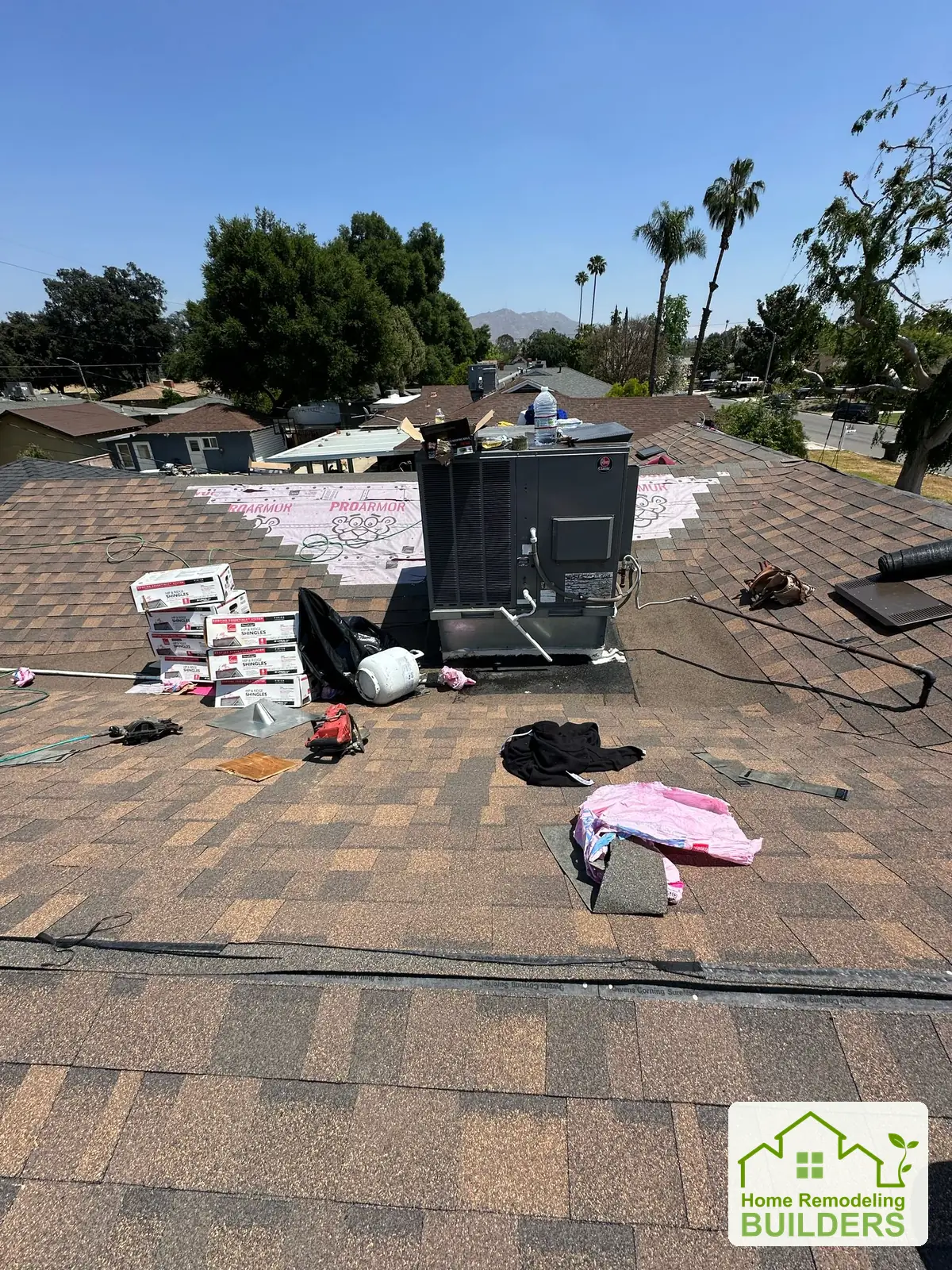 Installation progressing around the rooftop equipment. Riverside roofing project.