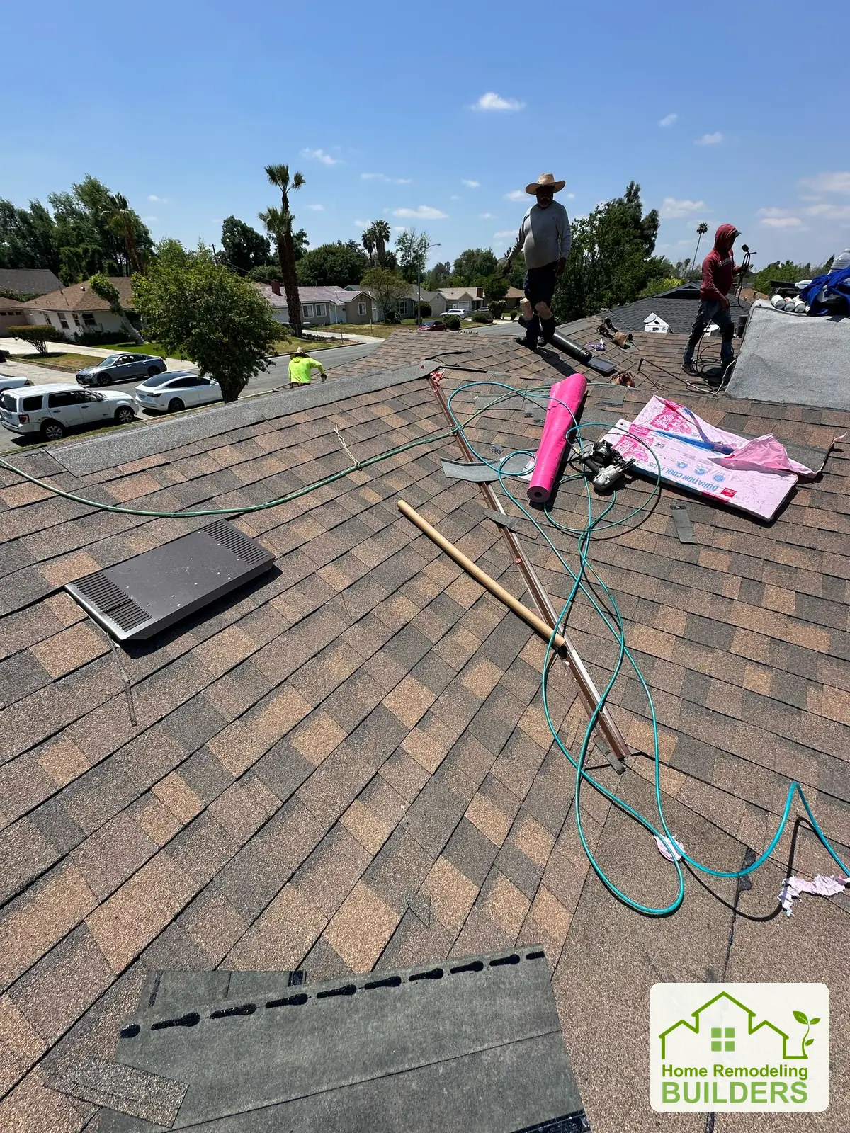 The crew and tools during the shingle installation. Riverside roofing project.