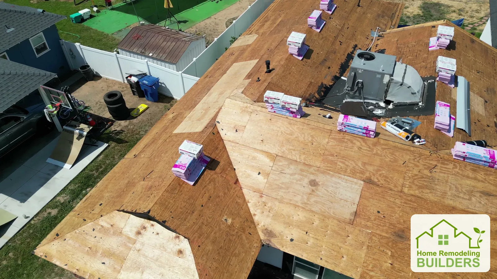 A close aerial view of the new sheathing and materials around the rooftop equipment. Riverside roofing project.
