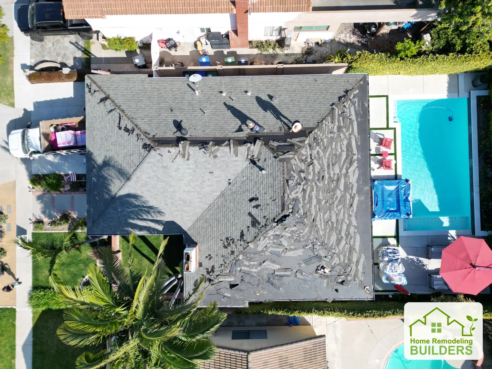 A straight-down view during shingle removal. Santa Ana roofing project.