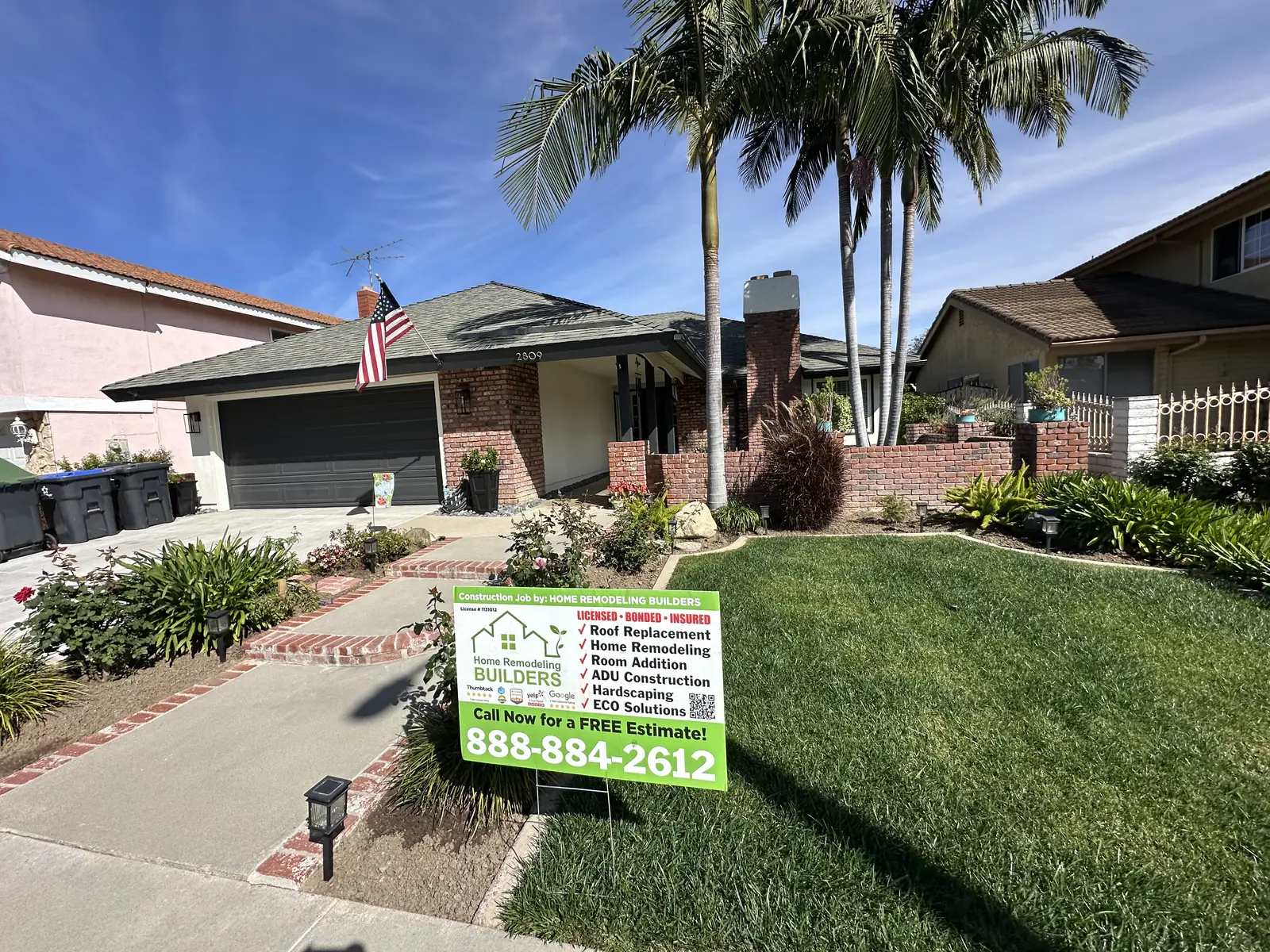 The finished roof and Home Remodeling Builders jobsite sign. Santa Ana roofing project.