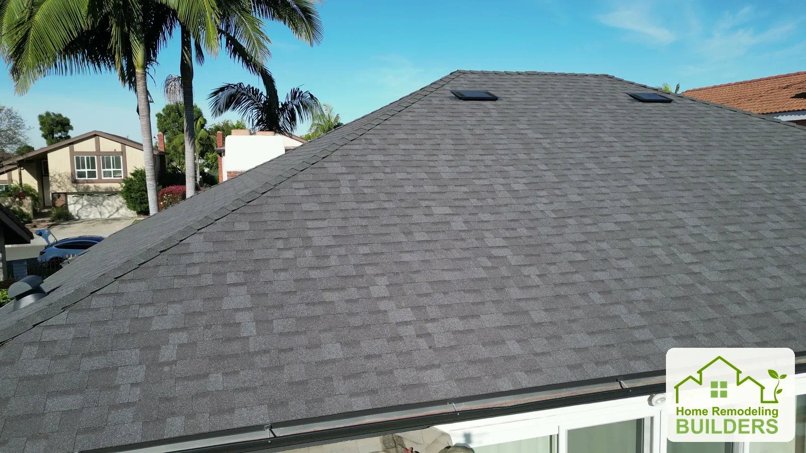 A close view of the finished shingle courses and roof vent. Santa Ana roofing project.