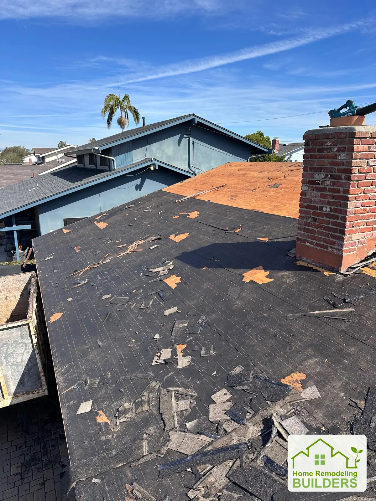 Old roofing removed around the chimney. Westminster roofing project.