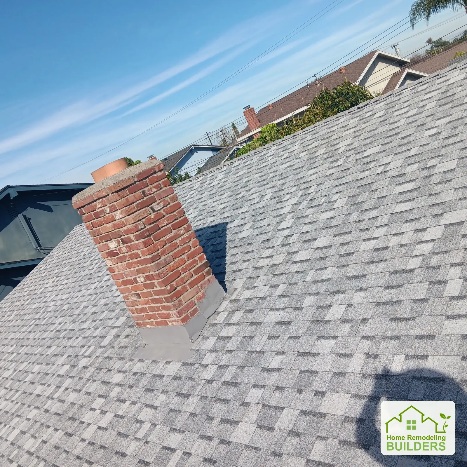 New shingles and flashing around the chimney. Westminster roofing project.