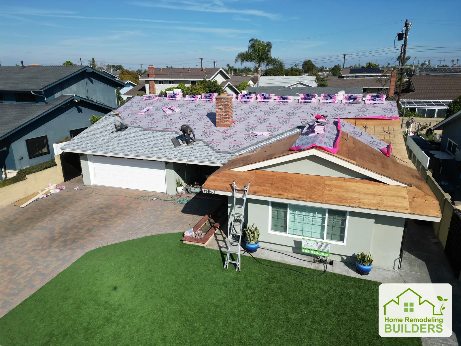 Installation progressing above the front elevation. Westminster roofing project.