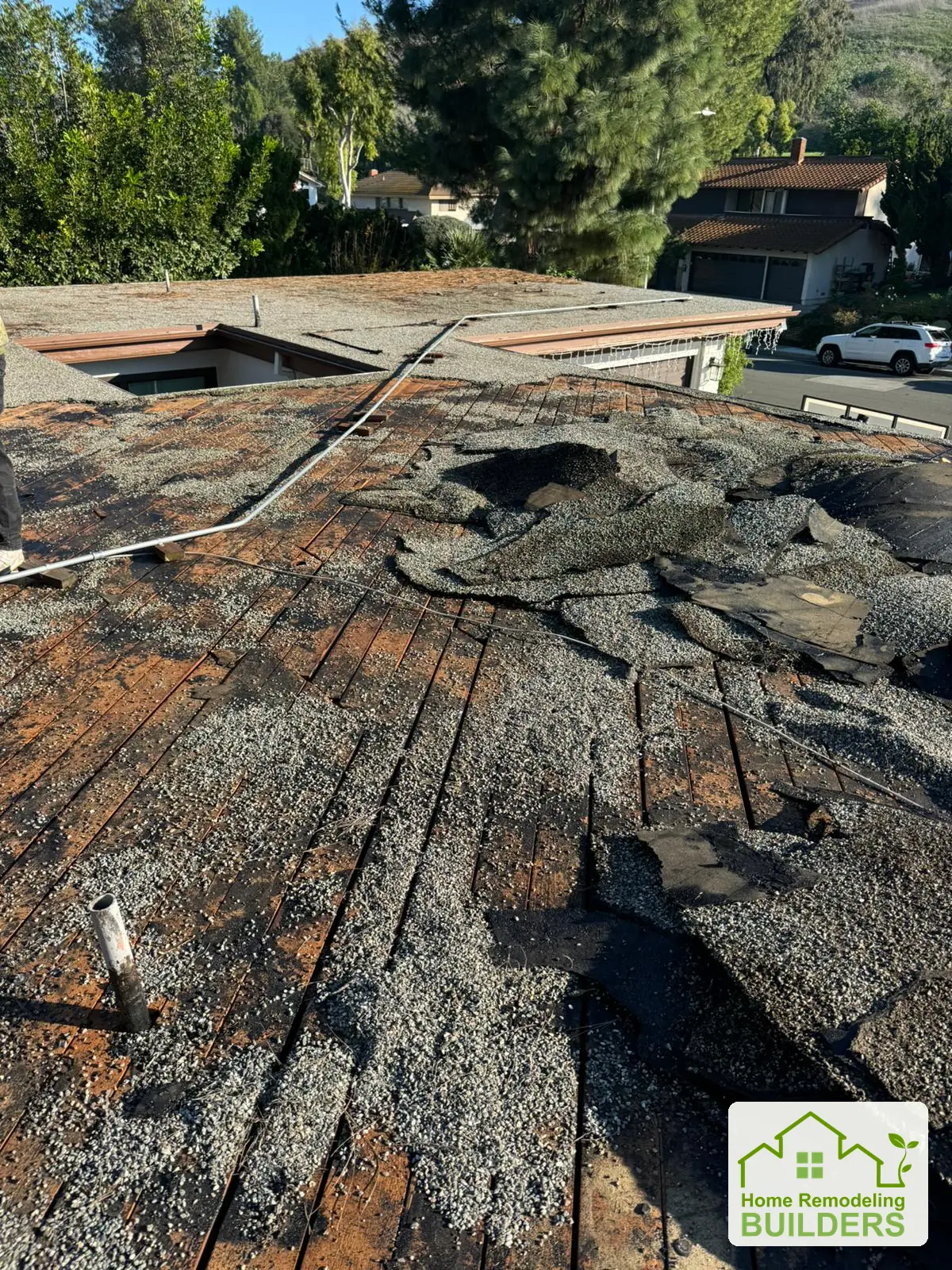 Old roofing removed to expose the underlying deck. Whittier Â· Flat roof roofing project.