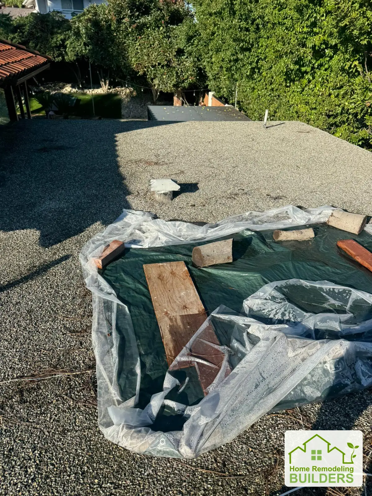 The skylight opening protected during roof removal. Whittier Â· Flat roof roofing project.