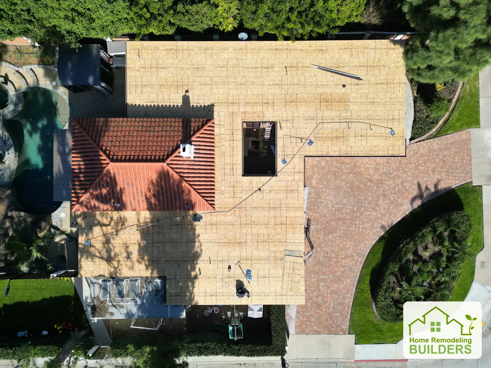 A straight-down view of the newly sheathed roof. Whittier Â· Flat roof roofing project.