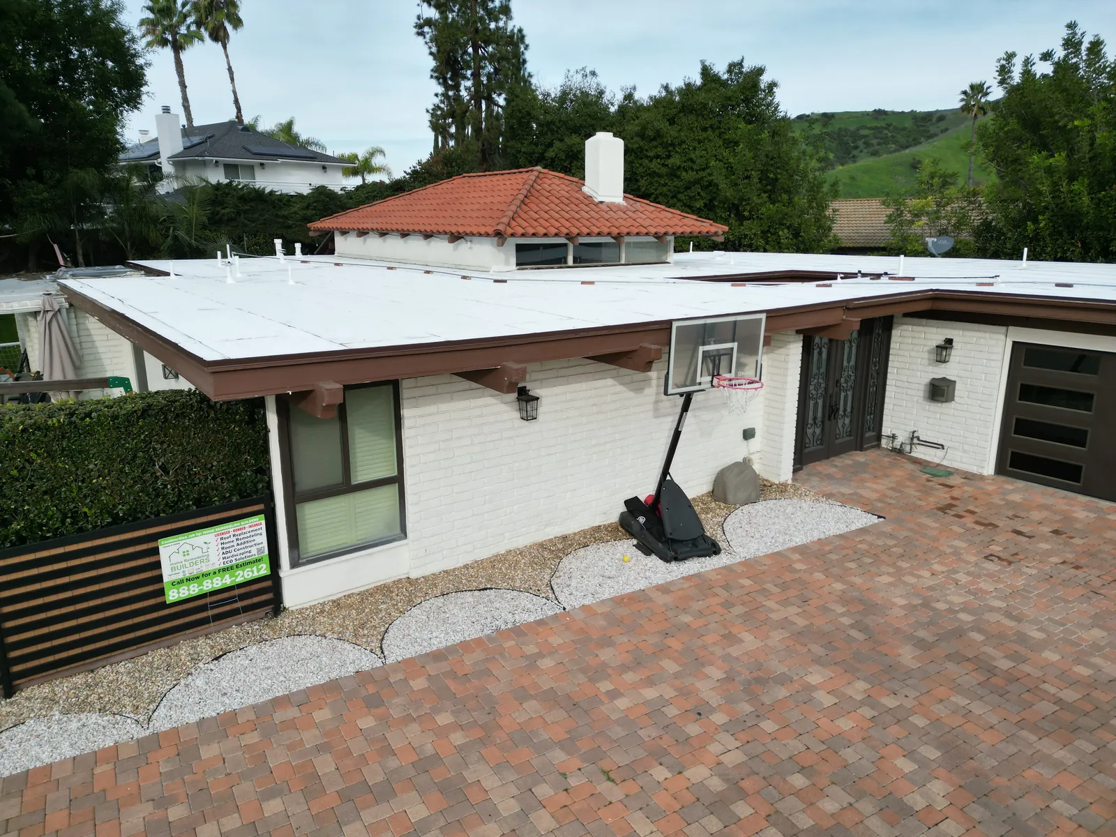 The completed roof surface above the front elevation. Whittier Â· Flat roof roofing project.