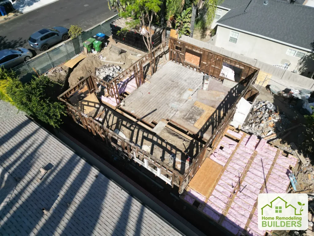 September rear aerial view of the remaining framing and cleared interior.
