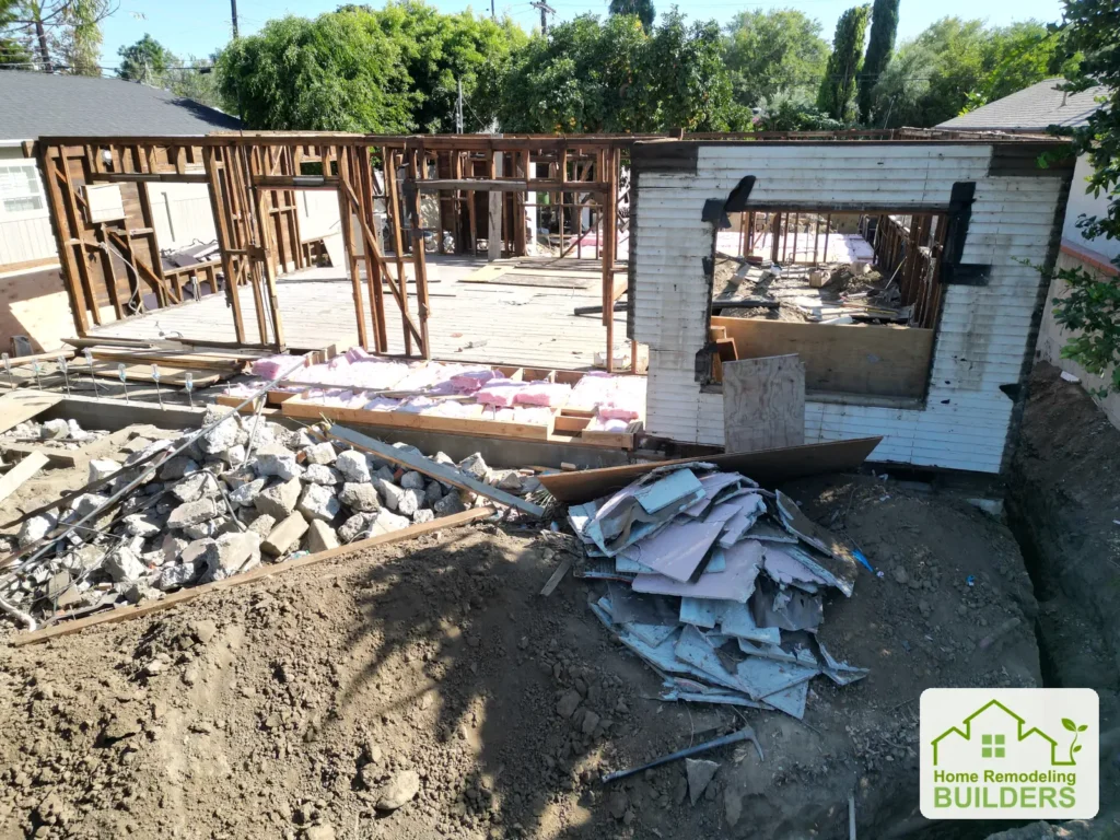 A close view of the exposed opening, remaining framing and demolition debris.